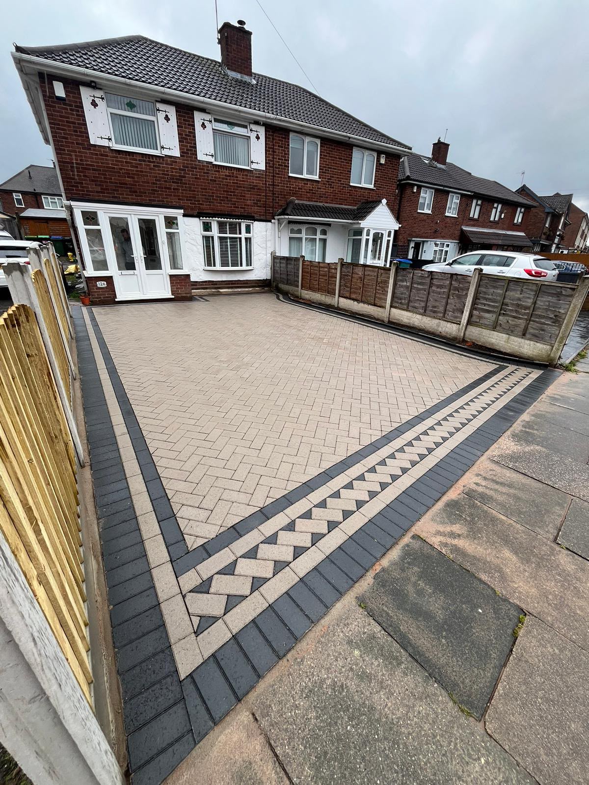 Buff block paving driveway with double soldier-course border